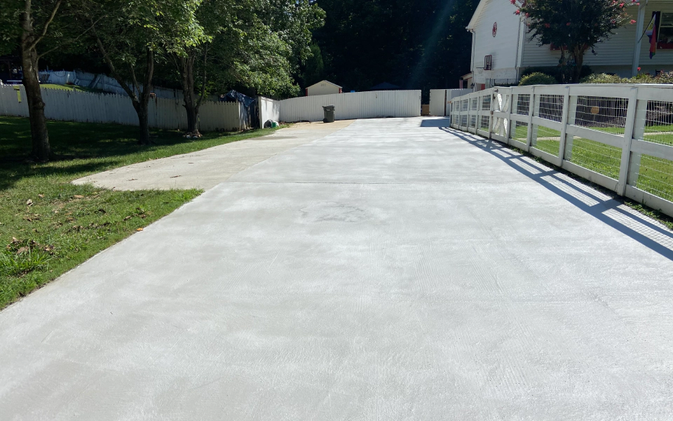 a recently repaired concrete driveway